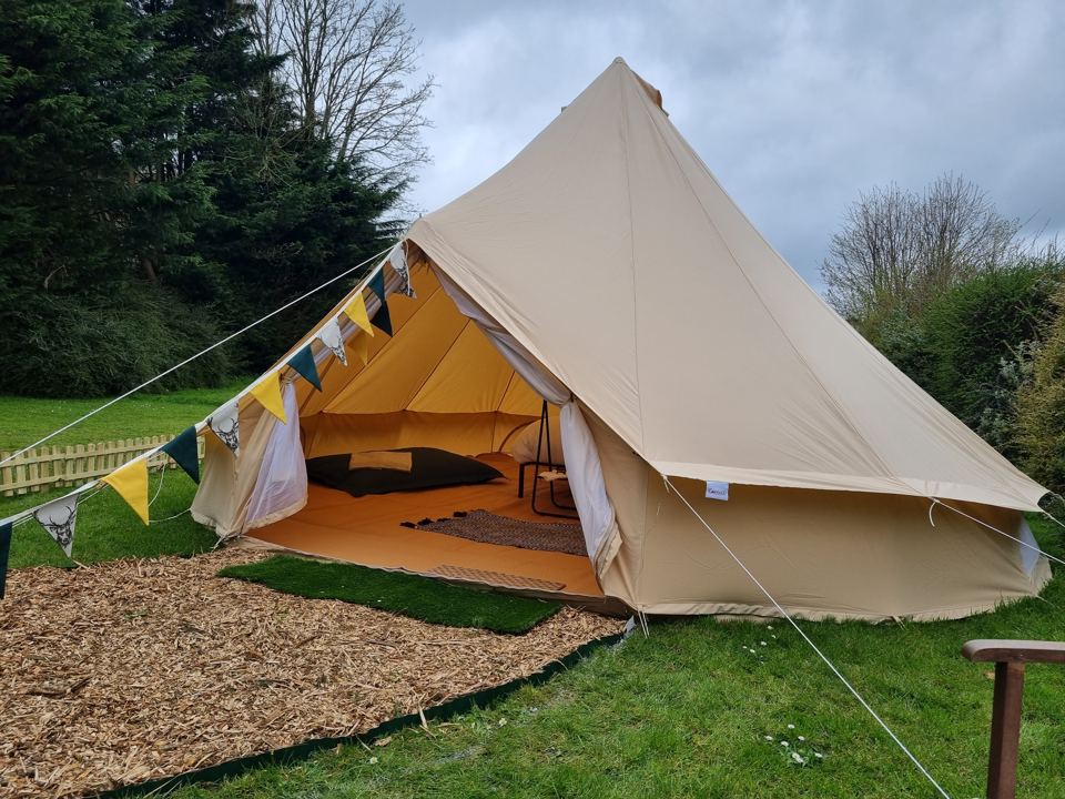 Bell tent with bunting on the chippings