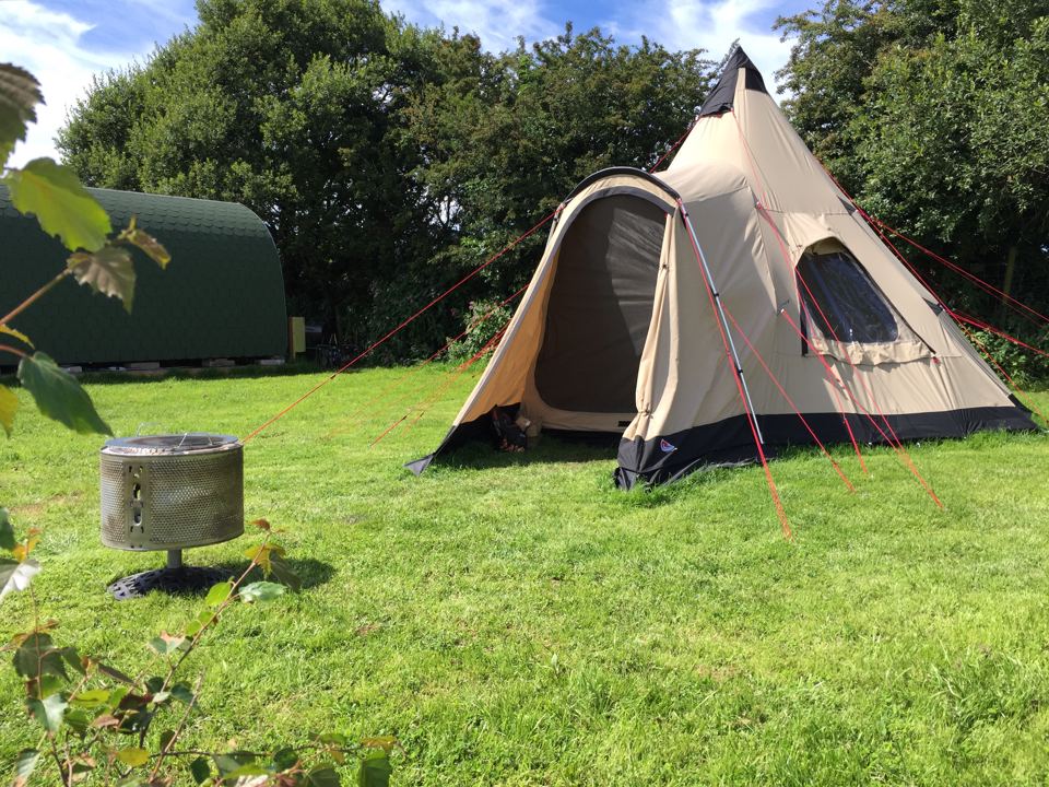 Tipi and pod on the grass