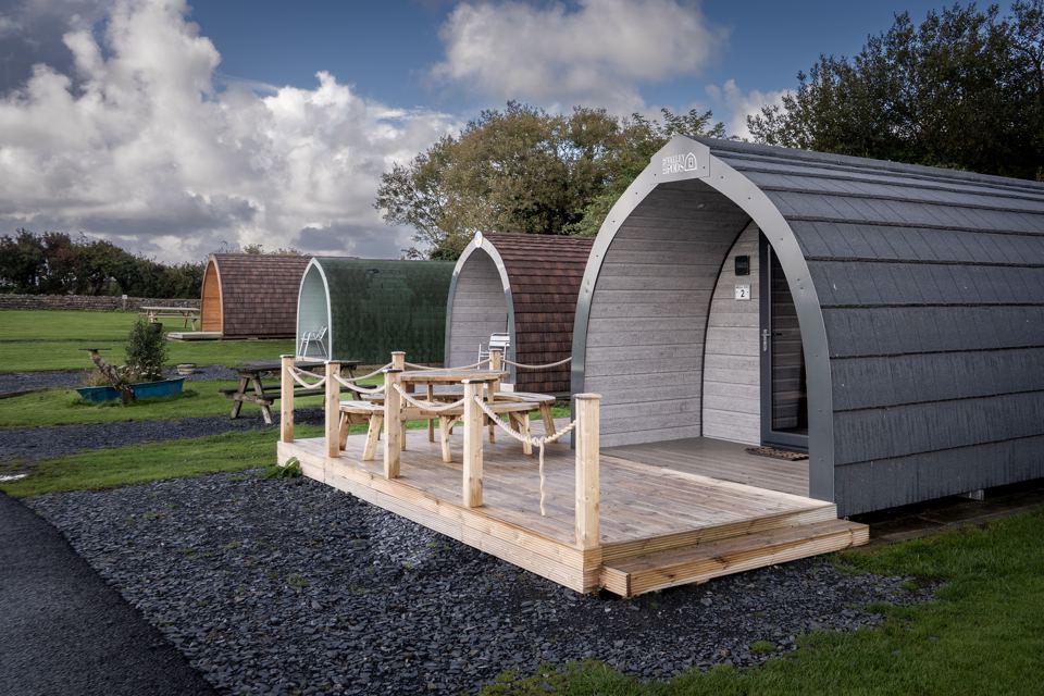 Pods with decking on the grass