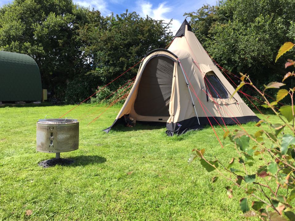 Tipi beside a fire pit