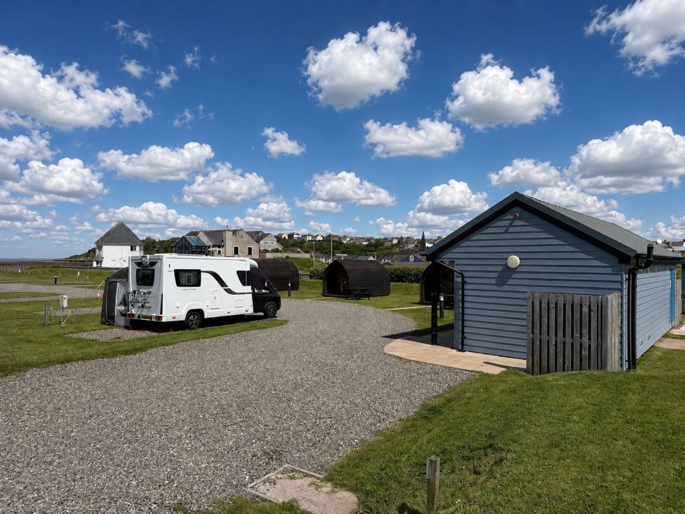 Motorhome on gravel pitch by the cabin