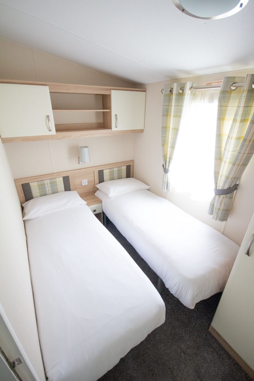 Twin bedroom with white bedding