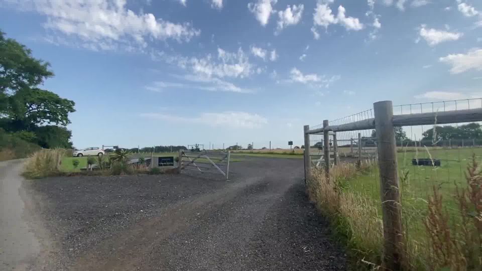 Gravel track and entrance gate