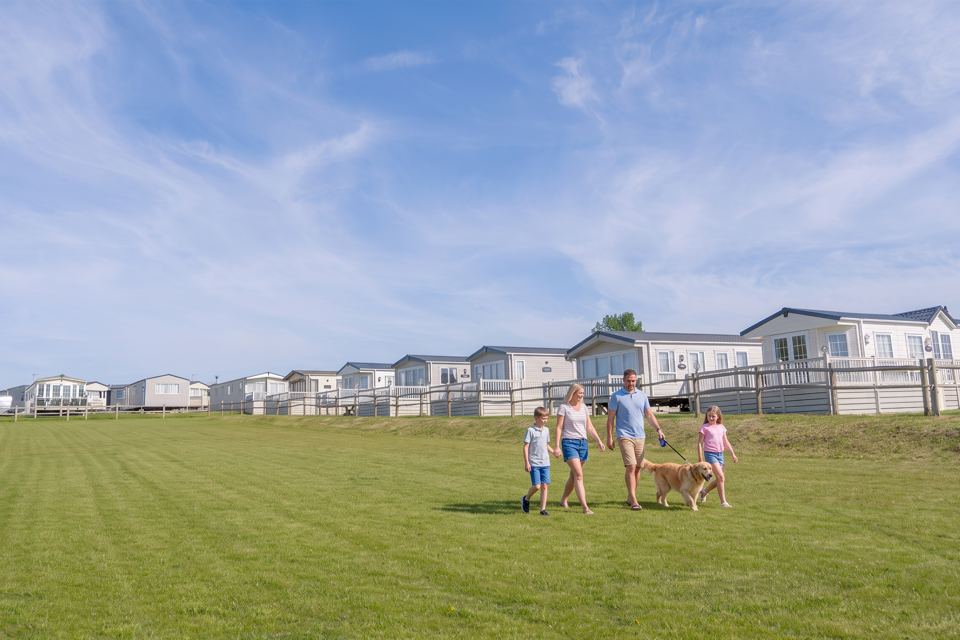 Caravans around a grass field
