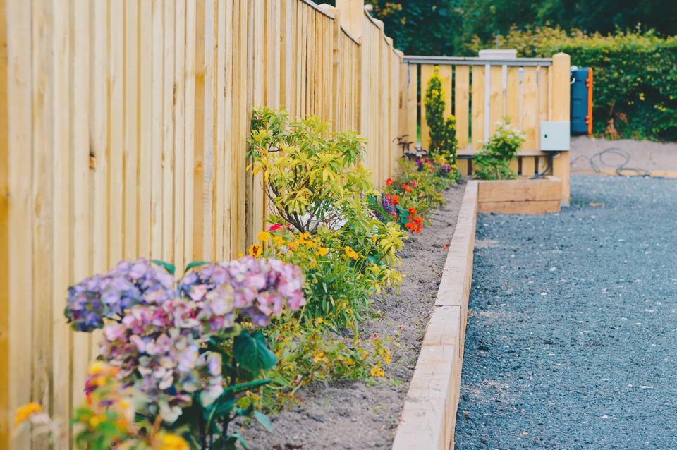 Gravel pitch edged with planting