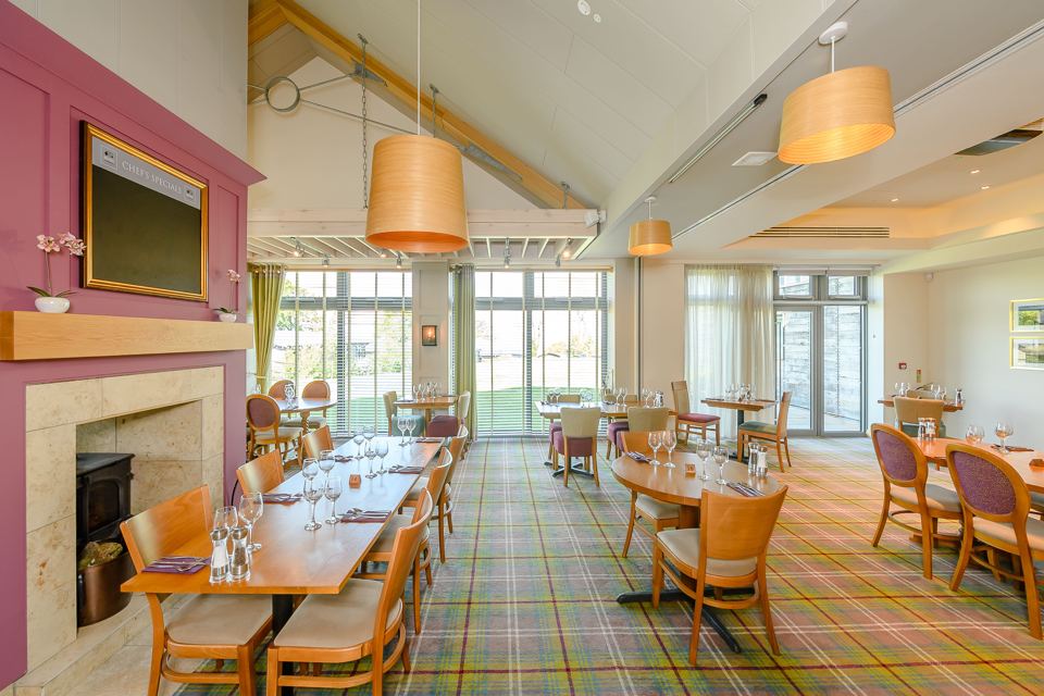 Bistro with tables and fireplace