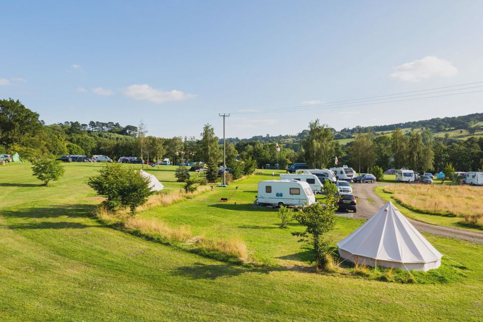 Pitches and bell tent on the lawn
