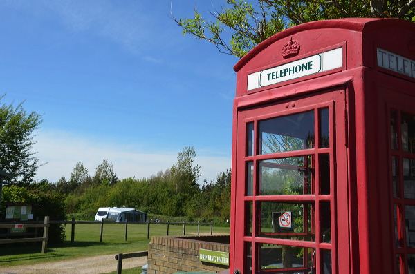 Old red phone box on site