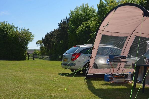Family tent on a big grass pitch