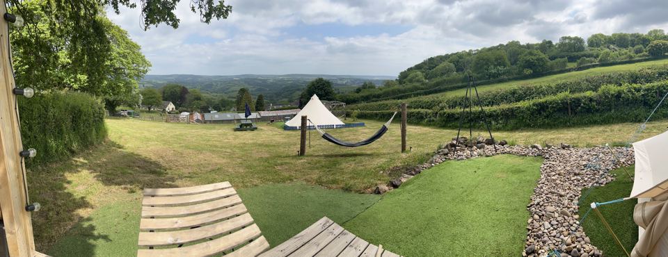 Bell tent and hammock on the slope