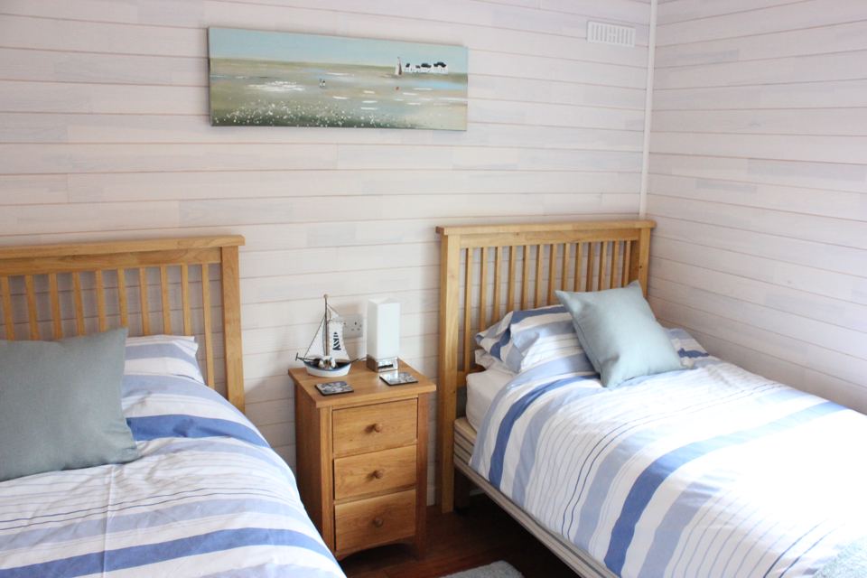 Twin bedroom with blue stripes