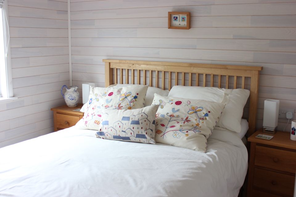 Double bed with patterned cushions