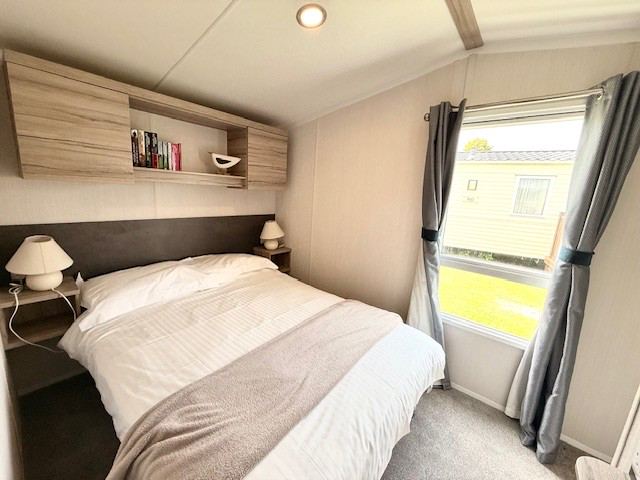 Double bedroom with grey curtains