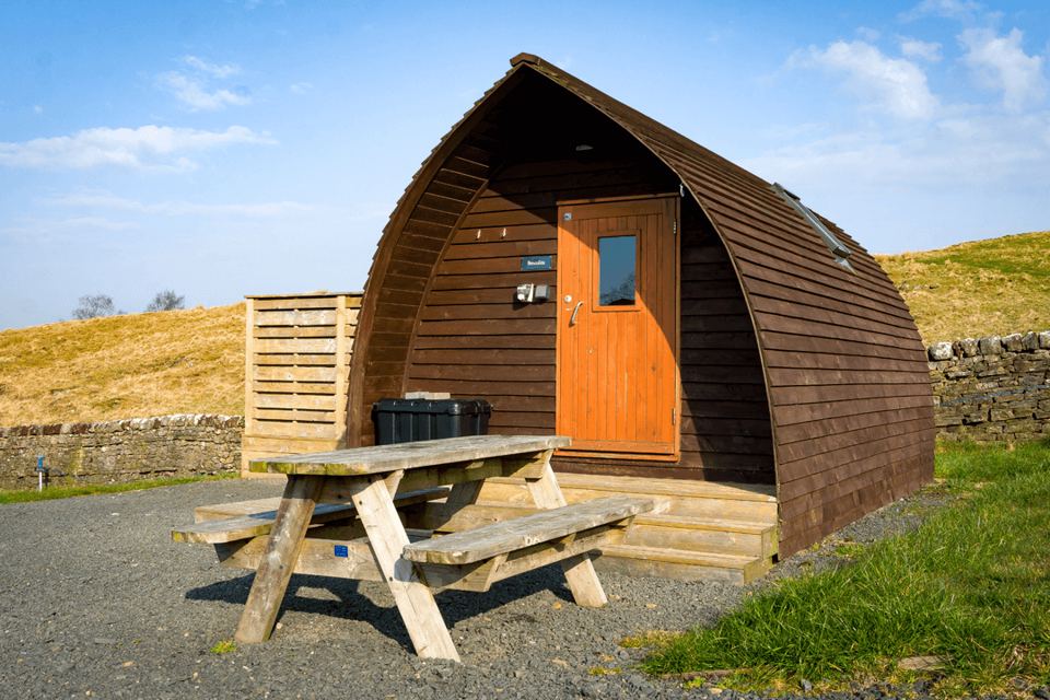 Wigwam cabin with picnic bench