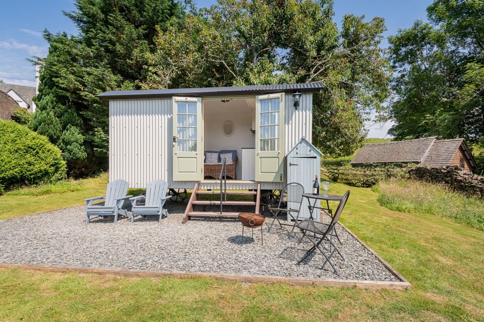 Shepherd's hut with chairs