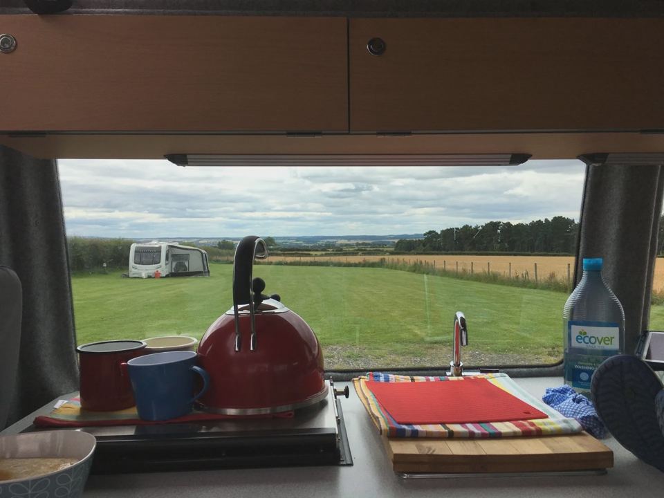 View over the field from a van window