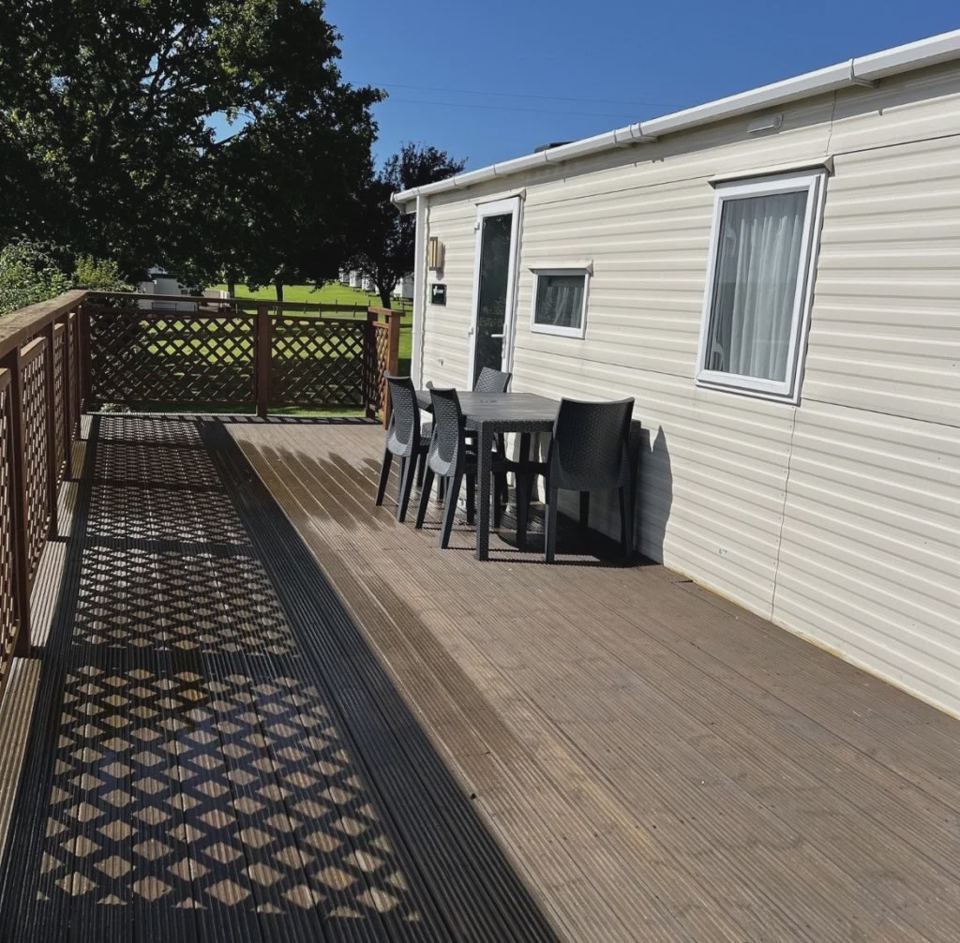 Static caravan with decking and table