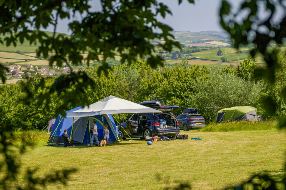 Tents on grass with a view