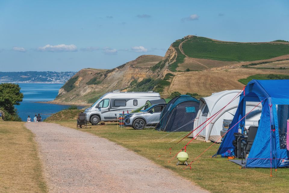 Tents and vans by the coast