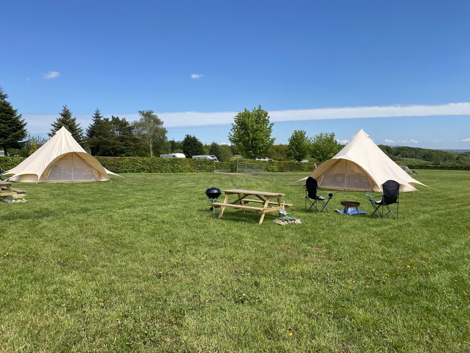 Two bell tents on the grass