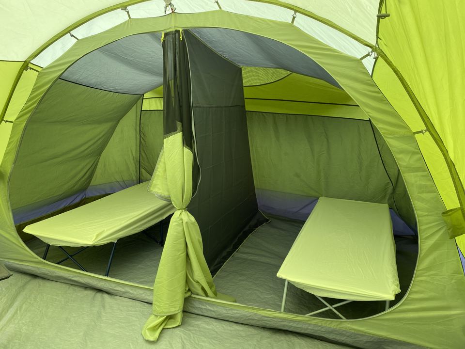 Camp beds in a pre-pitched tent