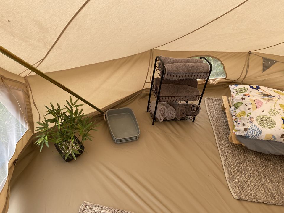 Bed inside a bell tent