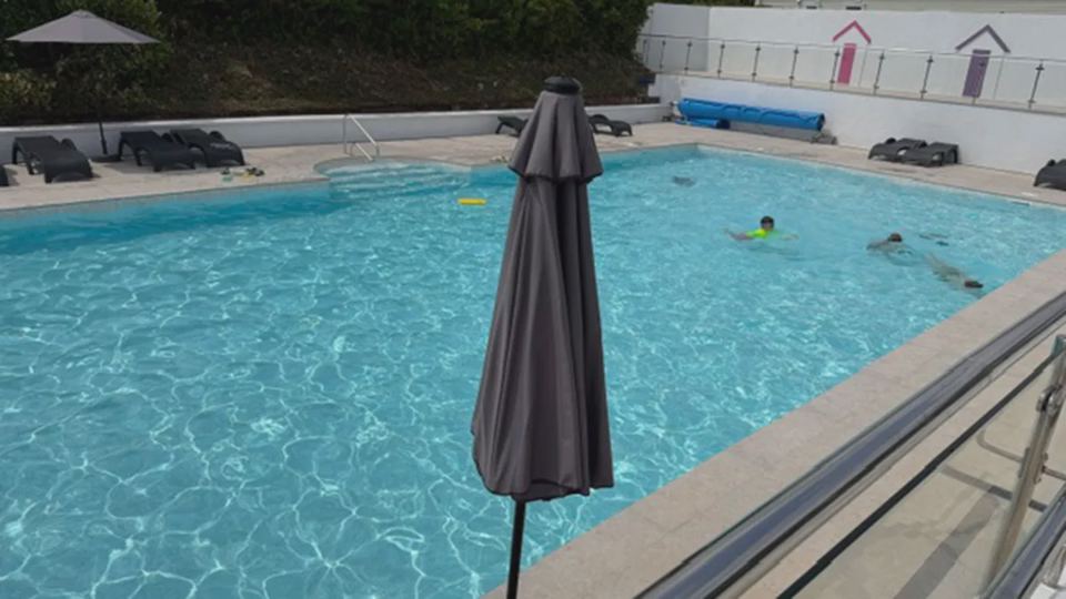 Outdoor pool with umbrella