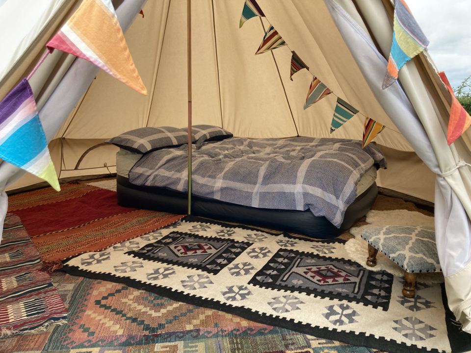 Inside a kitted-out bell tent