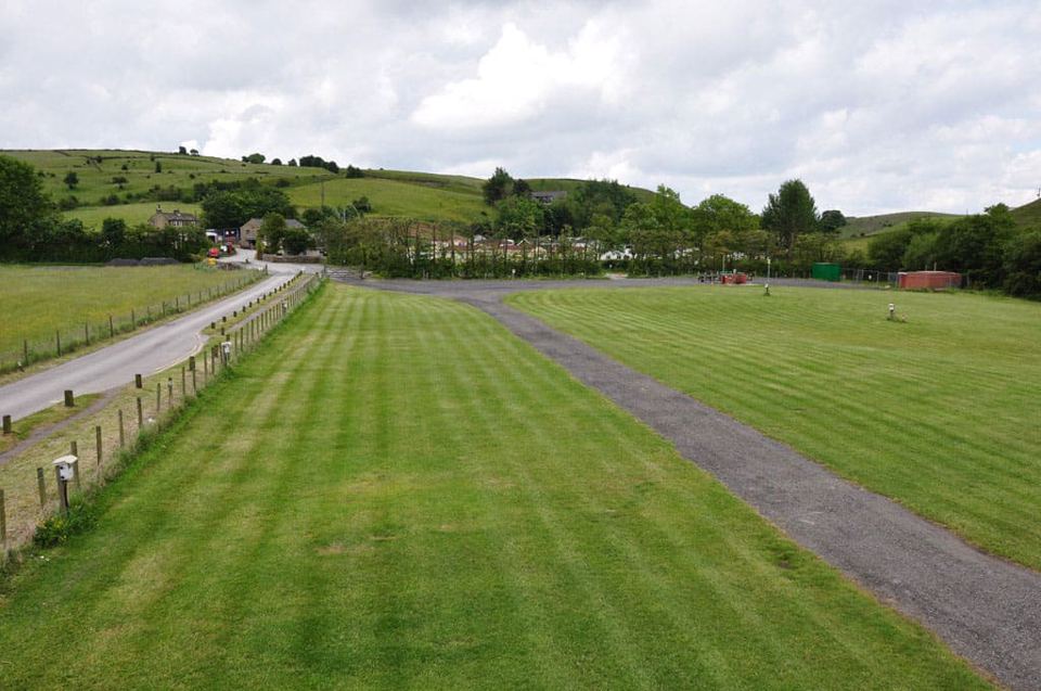 Mown grass pitches and tarmac track