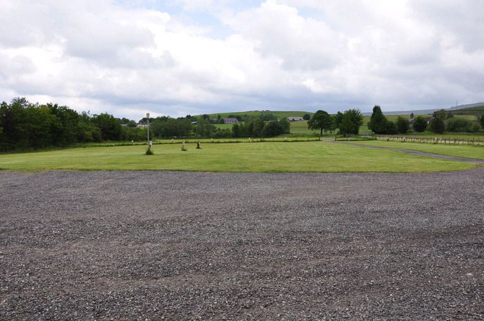 Hardstanding with hills behind