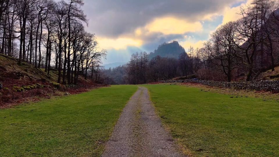 Track across the meadow to the fells