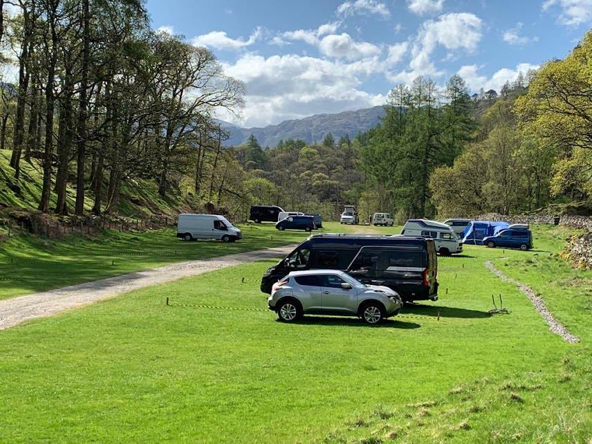 Vehicles parked on the grass pitches
