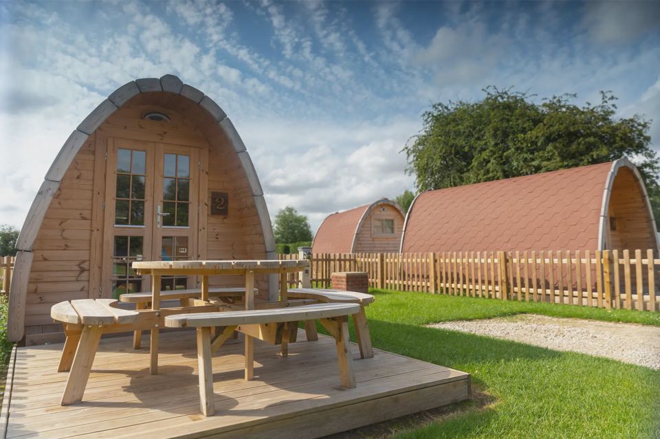 Camping pods with picnic benches