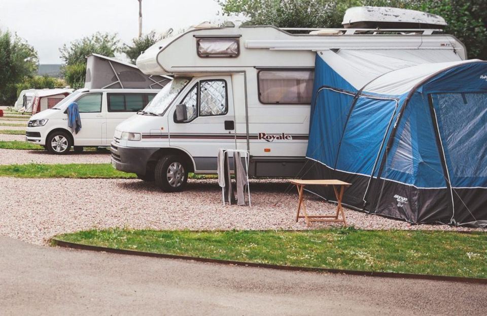 Motorhome with awning on gravel