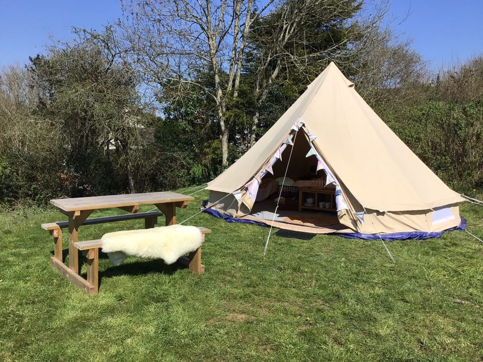 Bell tent beside picnic bench