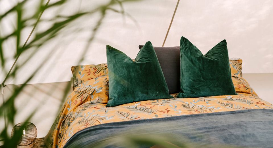 Bedroom with green cushions