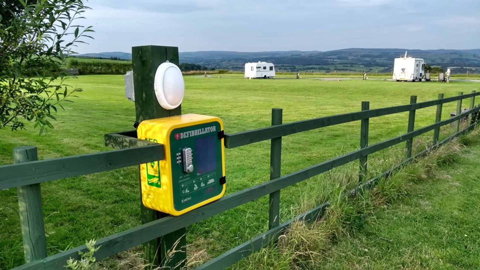 Pitches and defibrillator on the fence