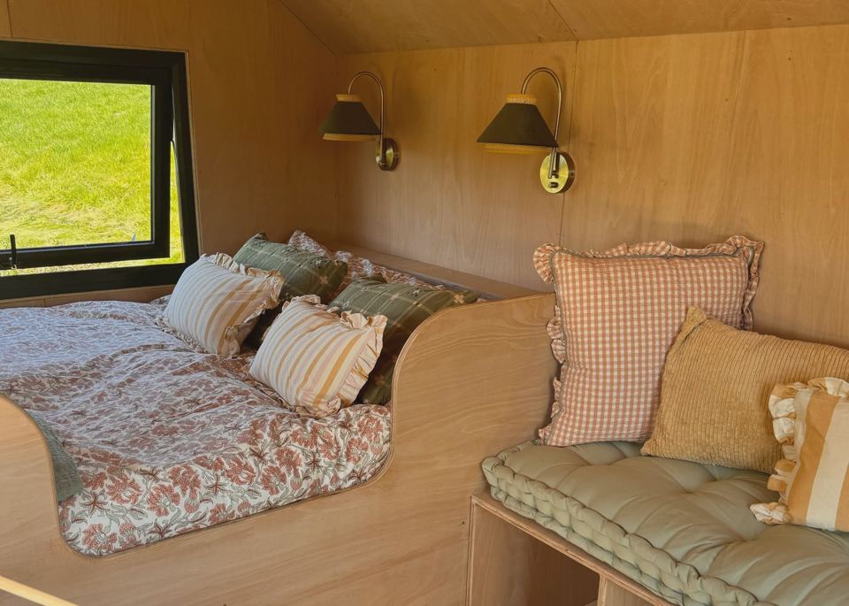 Inside a hut, bed and sofa