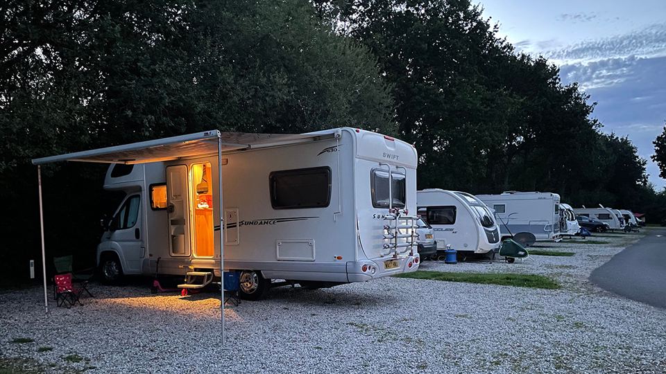 Motorhome with awning in the evening