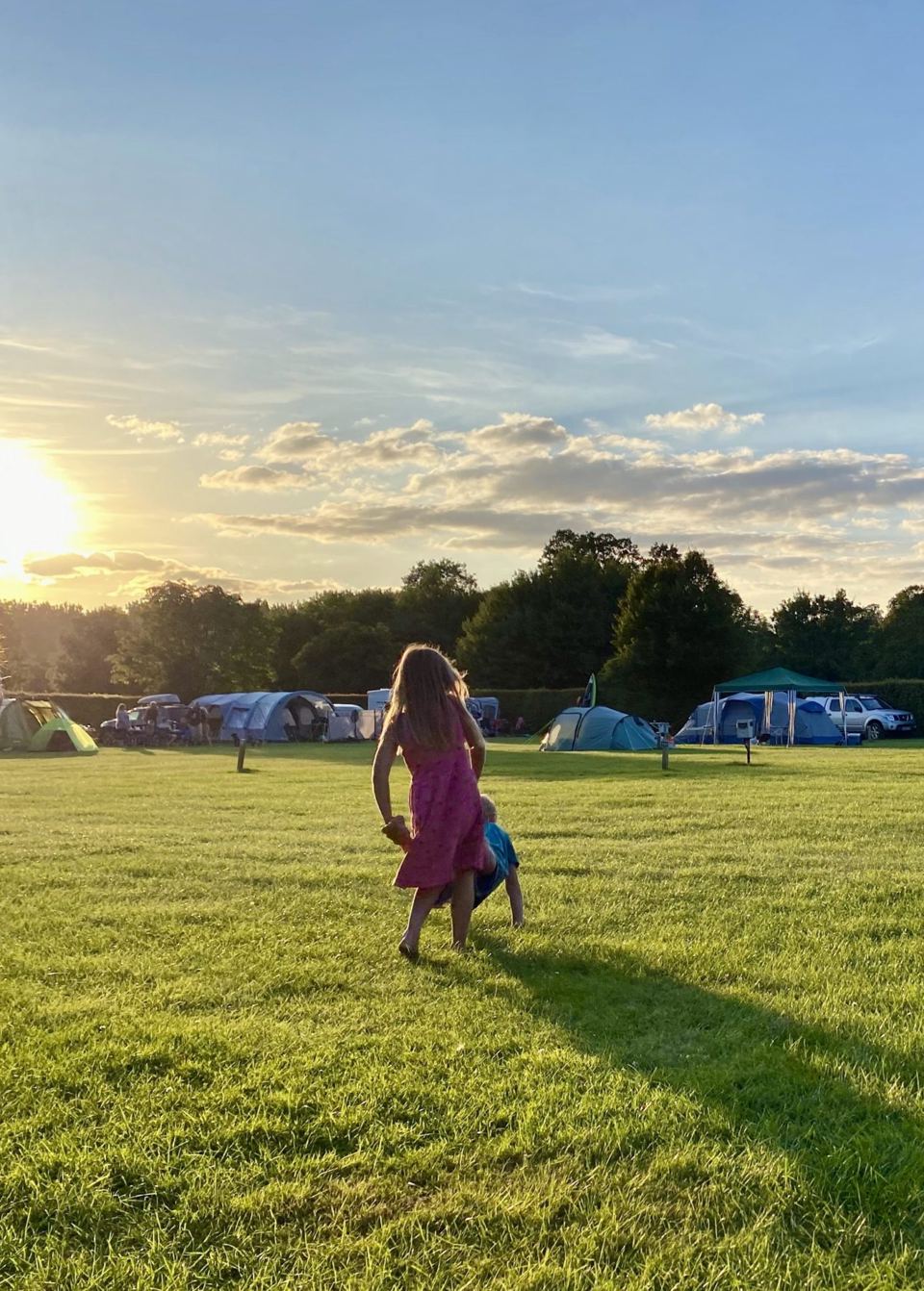 Tent field in evening sun