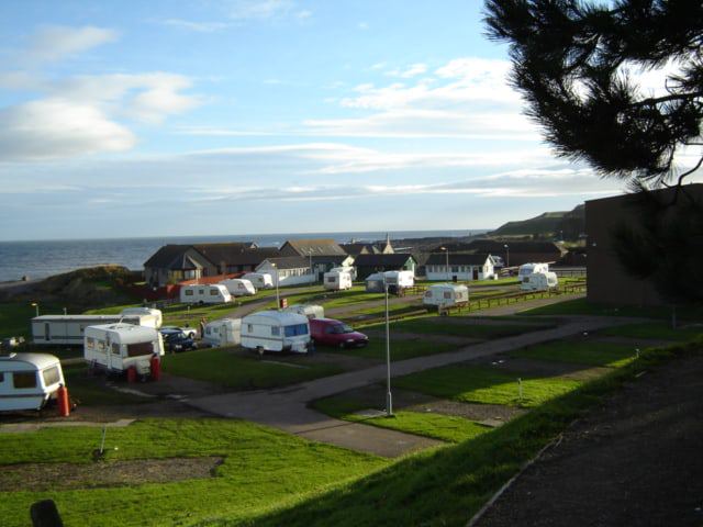 Tourers and tents above the coast