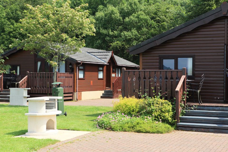 Timber lodges with stone barbecues