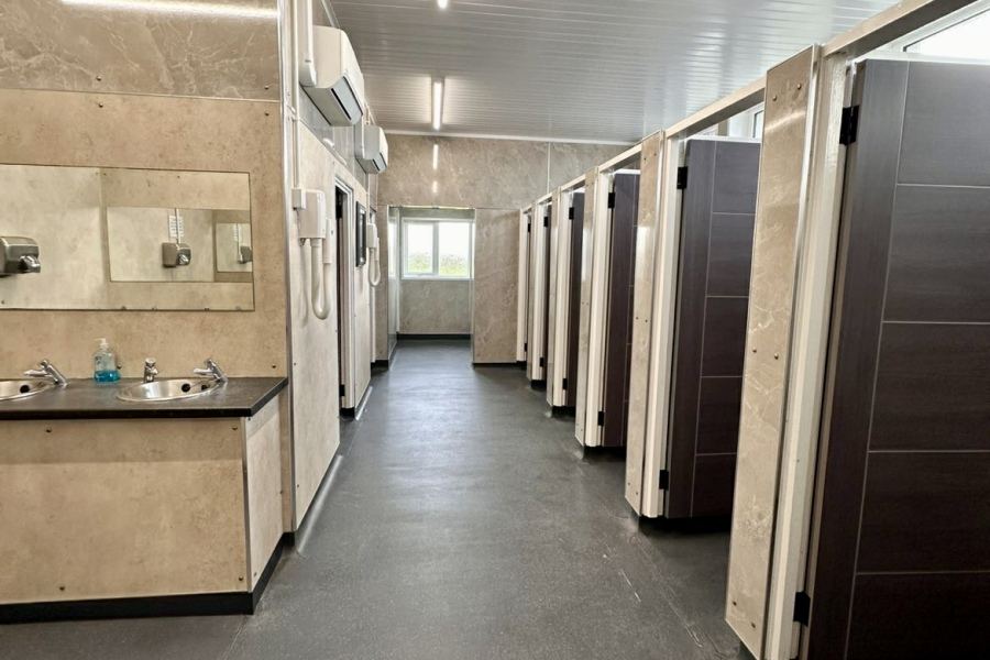 Row of shower and toilet cubicles