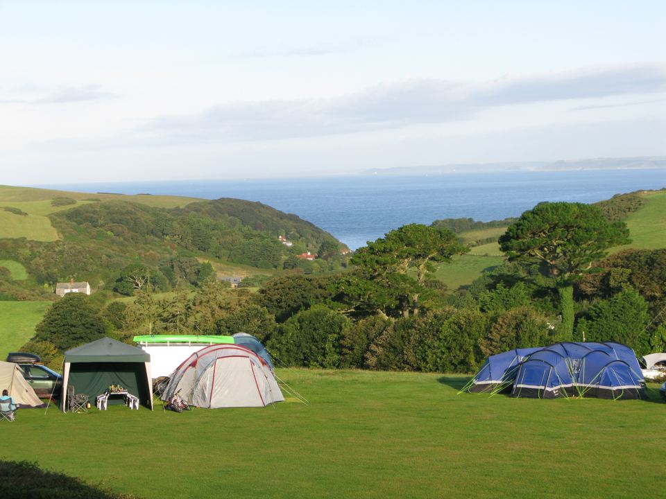 Tents on the grass with sea view