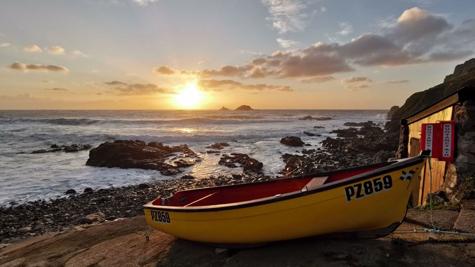 Boat on the shingle at sunset