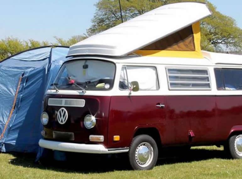 Campervan with awning on grass