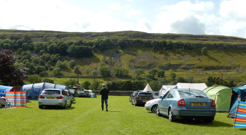Tents and cars on the main field