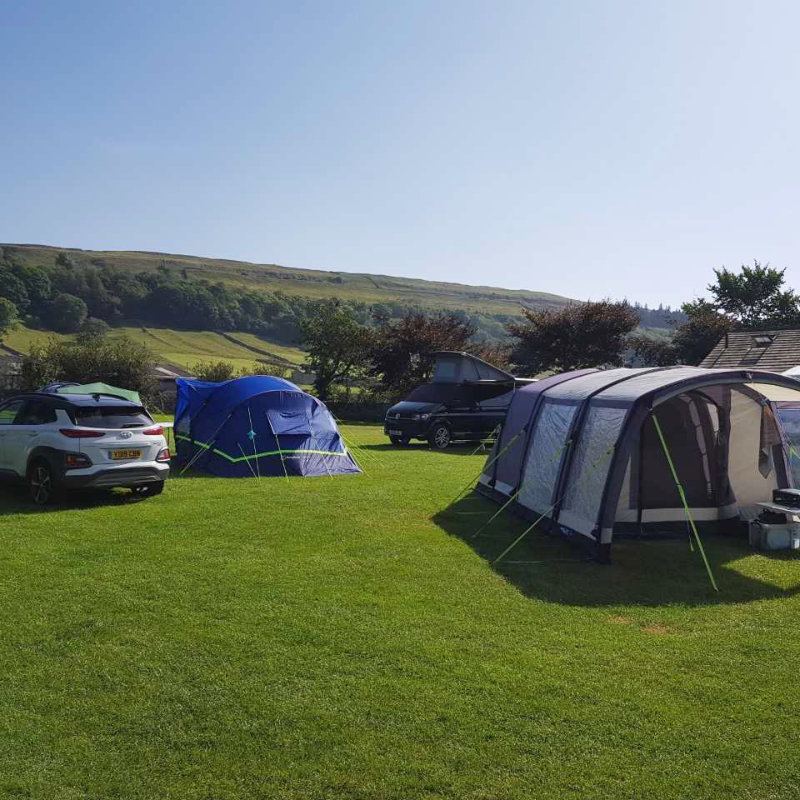 Tent and awning on grass