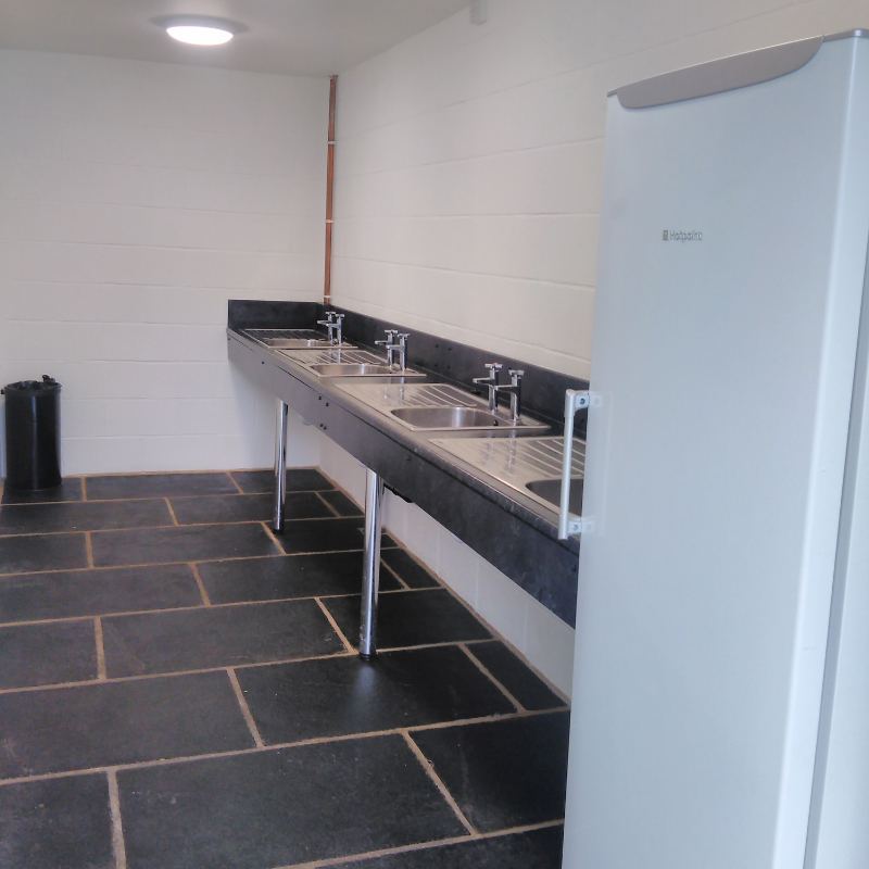 Pots room with fridge freezer