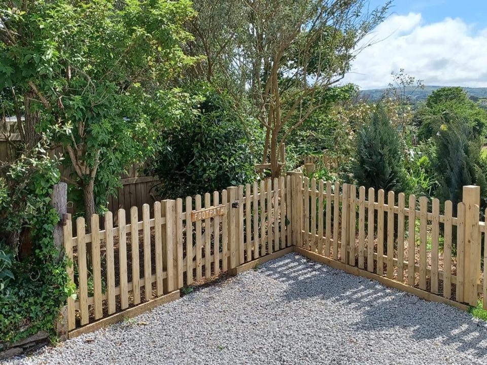 Gravel area beside wooden fence